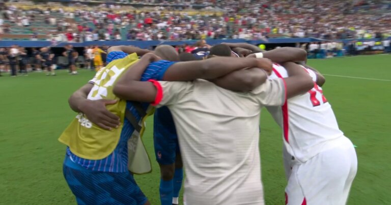 Emotional Embrace Between English and French Guests Following Third Place Match